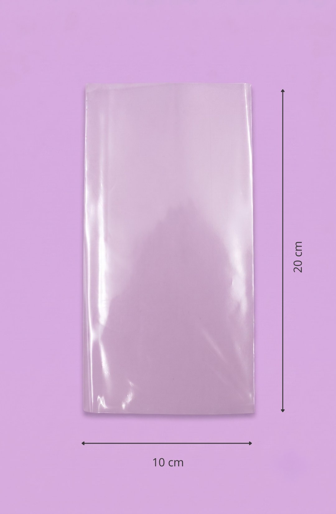 Bolsa de polipropileno transparente con sello lateral, medida 10x20 cm, sobre fondo lila