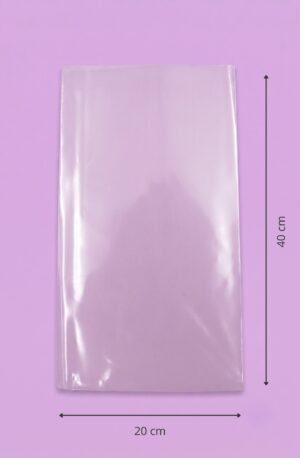 Bolsa de polipropileno transparente con sello lateral, medida 20x40 cm, sobre fondo lila